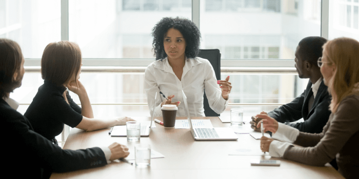 Female Company Leader hosting meeting