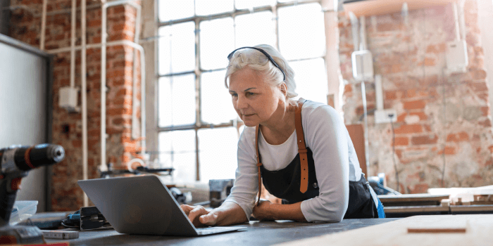 Woman in Workshop on Laptop